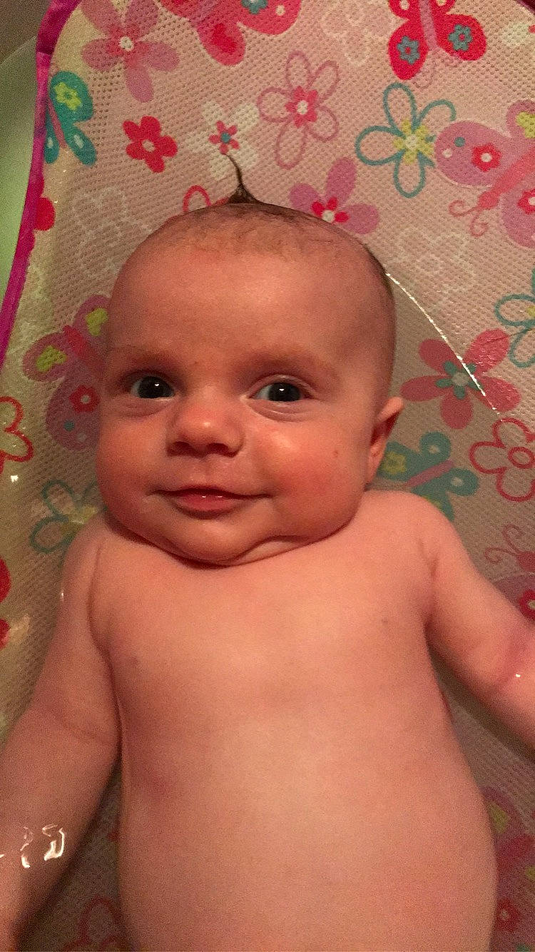 Leela is registered to the contest to win money with this photo: baby, cheek, chest, child, chin, close_up, eye, eyebrow, face, forehead, head, iris, joy, lip, mouth, muscle, nose, person, pink, skin