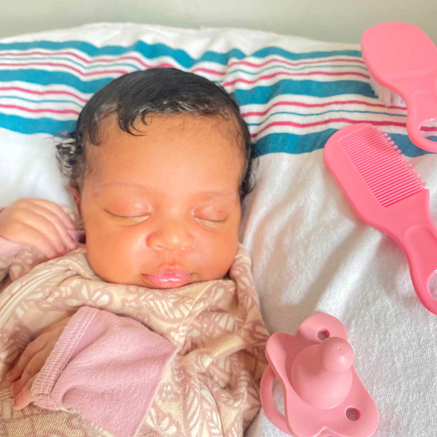 Nalani is registered to the contest to win money with this photo: infant, baby, sleeping, blanket, pacifier, comb, pink, bedspread, striped, cozy, soft, cute, peaceful, child, newborn, resting, indoors, clothing, hand, face