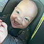 baby, smiling, infant, car_seat, child, blue_eyes, onesie, space_prints, happy, cute, portrait, seatbelt, clothing, indoor, closeup, face, head, hands, infant_baby, child_safety