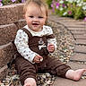 Cora joined the competition — help win amazing prizes! baby, child, infant, smiling, portrait, outdoor, garden, flowers, steps, stairs, rocks, stones, brown_outfit, overalls, floral_shirt, bare_feet, sitting, happy, face, nature
