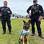 Countess Bella joined the competition — help win amazing prizes! police_officer, dog, german_shepherd, uniform, grass, outdoor, people, tent, leash, cape, smile, sunglasses, radio, badge, event, sky, walking, crowd, boots, hat
