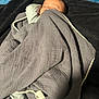Leo is registered to the contest to win money with this photo: baby, blanket, sleeping, infant, cozy, soft_texture, pom_pom, fabric, face, head, bedtime, rest, peaceful, indoor, child, person, wrapped, comfort, home, napping