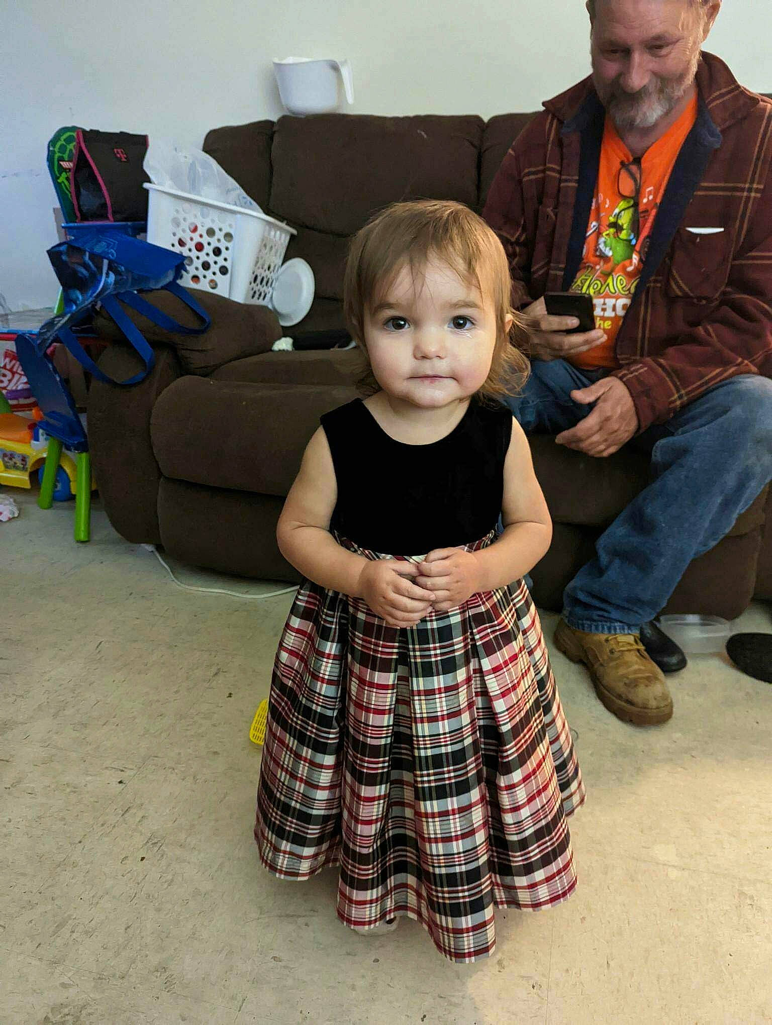 Haley is registered to the contest to win money with this photo: baby, child, event, flooring, fun, happy, joy, leisure, pattern, people, person, plaid, sandal, shoe, sitting, smile, tartan, toddler, vacation
