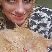 Ozzy is registered to the contest to win money with this photo: woman, cat, sleeping_cat, smiling, close_up, blonde_hair, blanket, cozy, indoor, pet, feline, face, resting, comfort, human, animal, portrait, happy, cuddle, warmth
