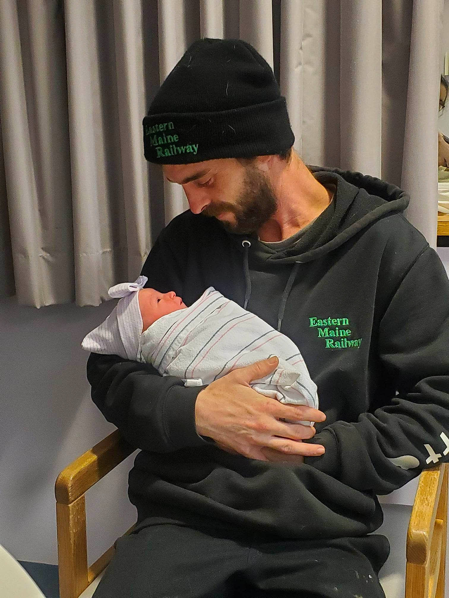 Isabella joined the competition — help win amazing prizes! baseball_cap, beanie, beard, cap, chair, comfort, curtain, elbow, event, hat, headwear, hoodie, human_leg, knee, lap, person, recreation, sitting, sleeve, t_shirt