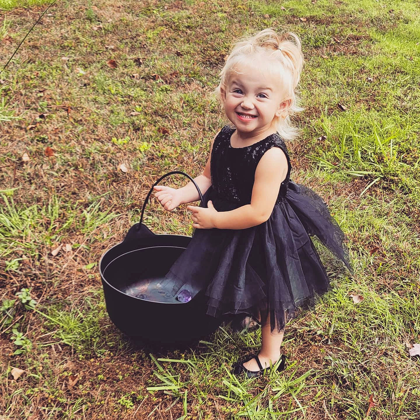Jordynn joined the competition — help win amazing prizes! baby_products, baby_toddler_clothing, basket, blond, child, child_model, clothing, costume, dress, footwear, grass, happy, joy, person, photography, plant, play, sitting, smile, summer