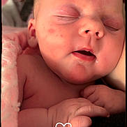 Delilah joined the competition — help win amazing prizes! baby, sleeping, close_up, infant, pink_blanket, hand, face, skin, newborn, peaceful, cute, portrait, resting, soft_light, indoors, human, child, love, heart, cozy