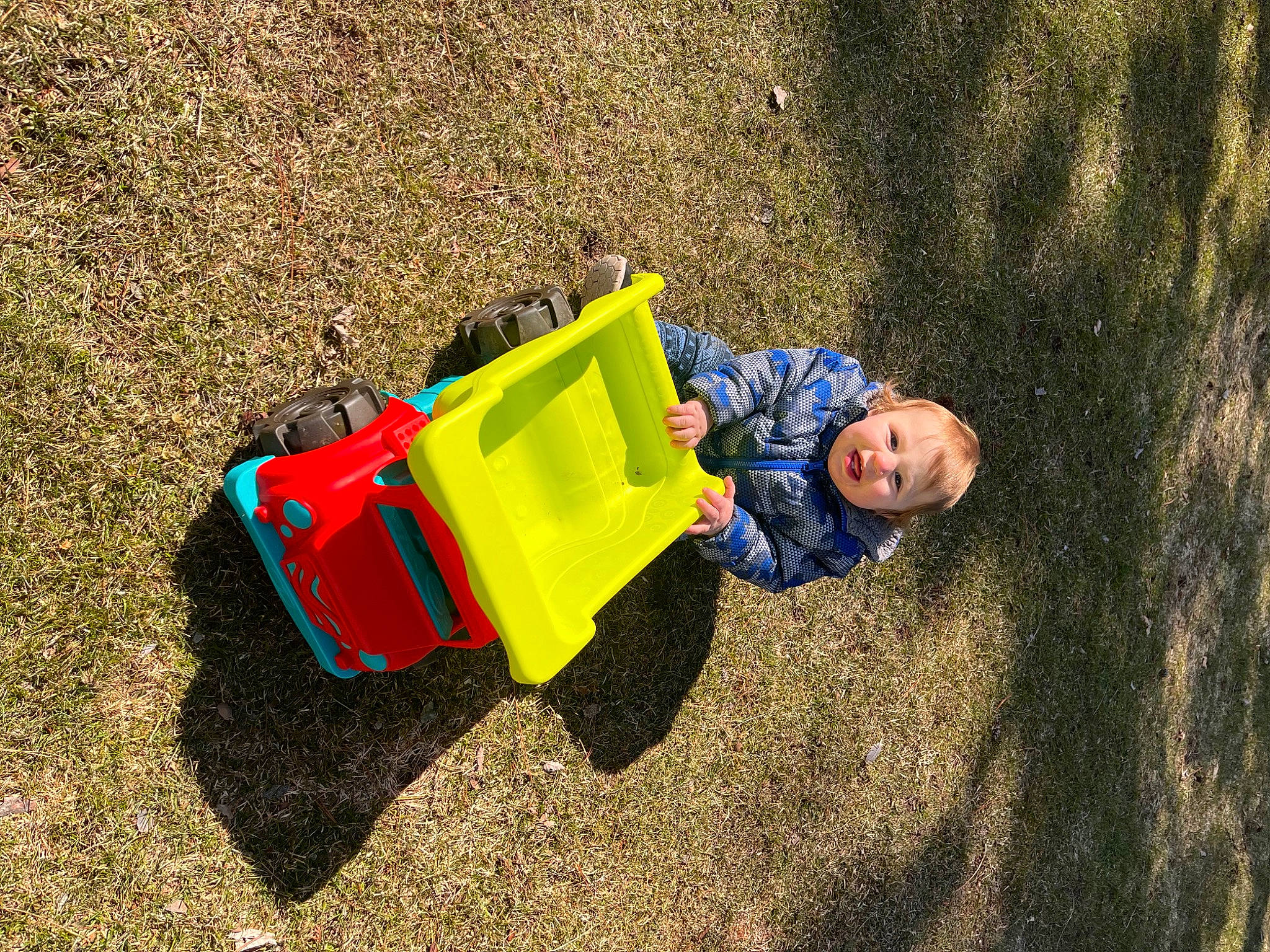 Carter joined the competition — help win amazing prizes! asphalt, city, electric_blue, field, fun, grass, landscape, leisure, motor_vehicle, outdoor_play_equipment, people_in_nature, person, recreation, road_surface, sand, shadow, soil, toddler, toy, wheel