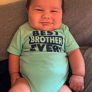 Mateo joined the competition — help win amazing prizes! baby, cheeks, child, chubby, clothing, comfortable, couch, cute, drool, furniture, happy, indoor, infant, onesie, person, portrait, relaxed, short_hair, sitting, smile