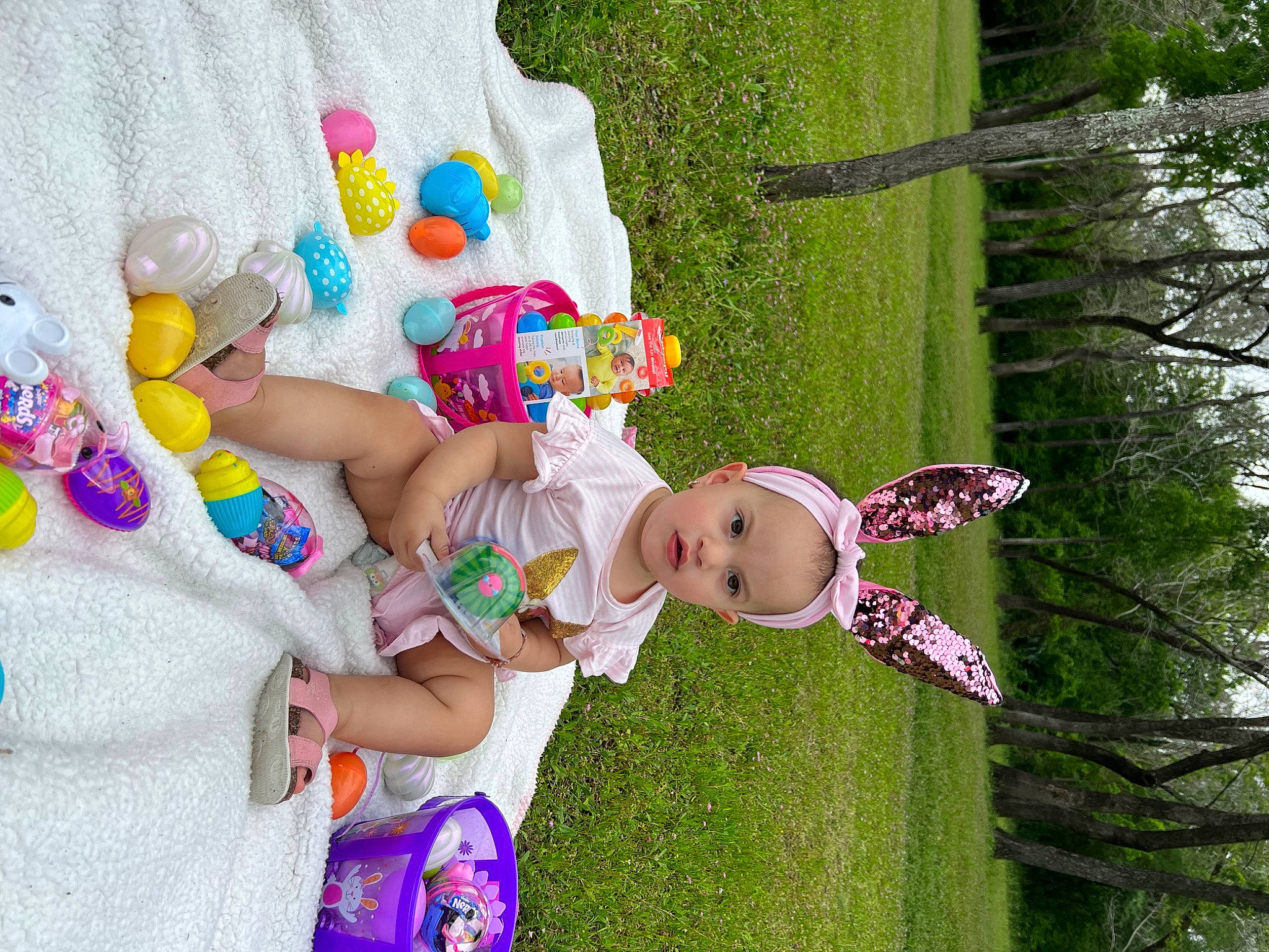 Amaya joined the competition — help win amazing prizes! baby, baby_products, baby_toddler_clothing, child, event, fun, grass, green, happy, leisure, party_supply, person, pink, plant, play, recreation, smile, stuffed_toy, toddler, toy