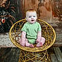 Ava joined the competition — help win amazing prizes! baby, child, red_hair, blue_eyes, green_onesie, rattan_chair, wooden_floor, rustic, portrait, indoor, cute, sitting, smiling, plush_skin, photography, studio, background, decor, infant, person
