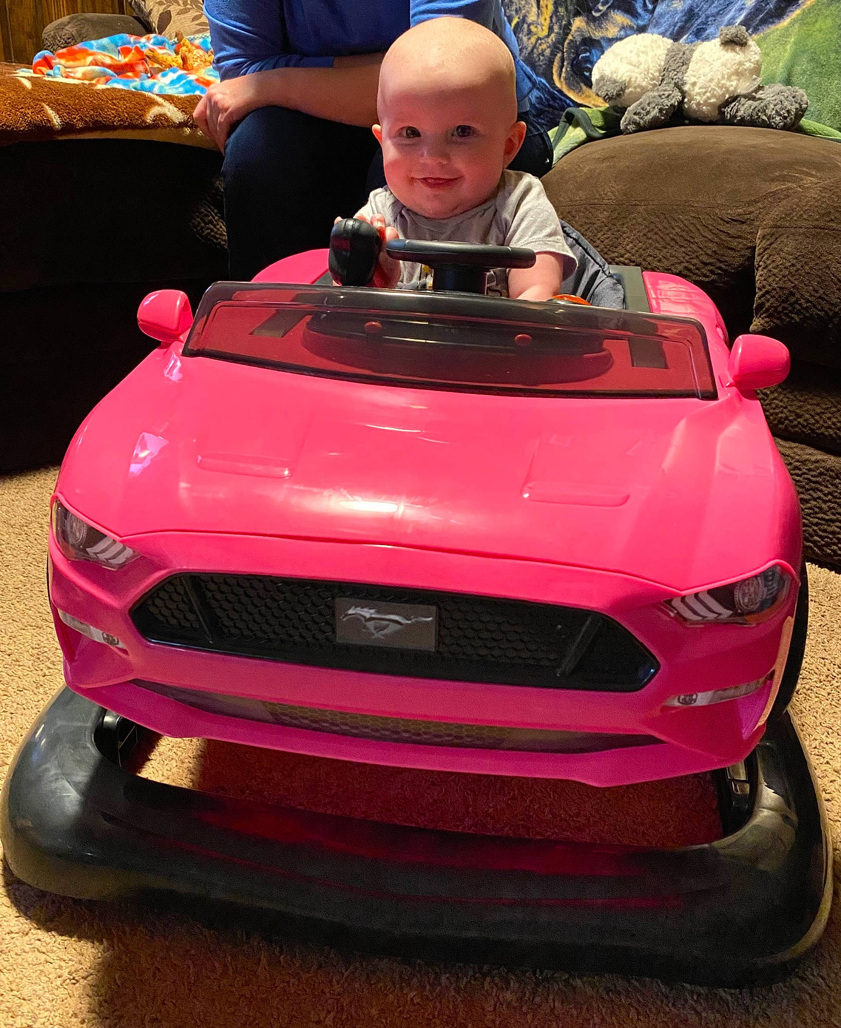 Isla joined the competition — help win amazing prizes! automotive_design, automotive_exterior, automotive_lighting, automotive_tire, bumper, car, fender, green, grille, headlamp, hood, joy, motor_vehicle, person, photograph, pink, rim, smile, tire, vehicle
