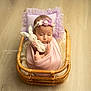 Mané participe au concours pour gagner de l'argent avec cette photo : baby, sleeping, wrapped, blanket, bunny_toy, wicker_basket, pillow, lavender, headband, flooring, cute, infant, peaceful, indoors, soft_lighting, portrait, newborn, cozy, child, resting