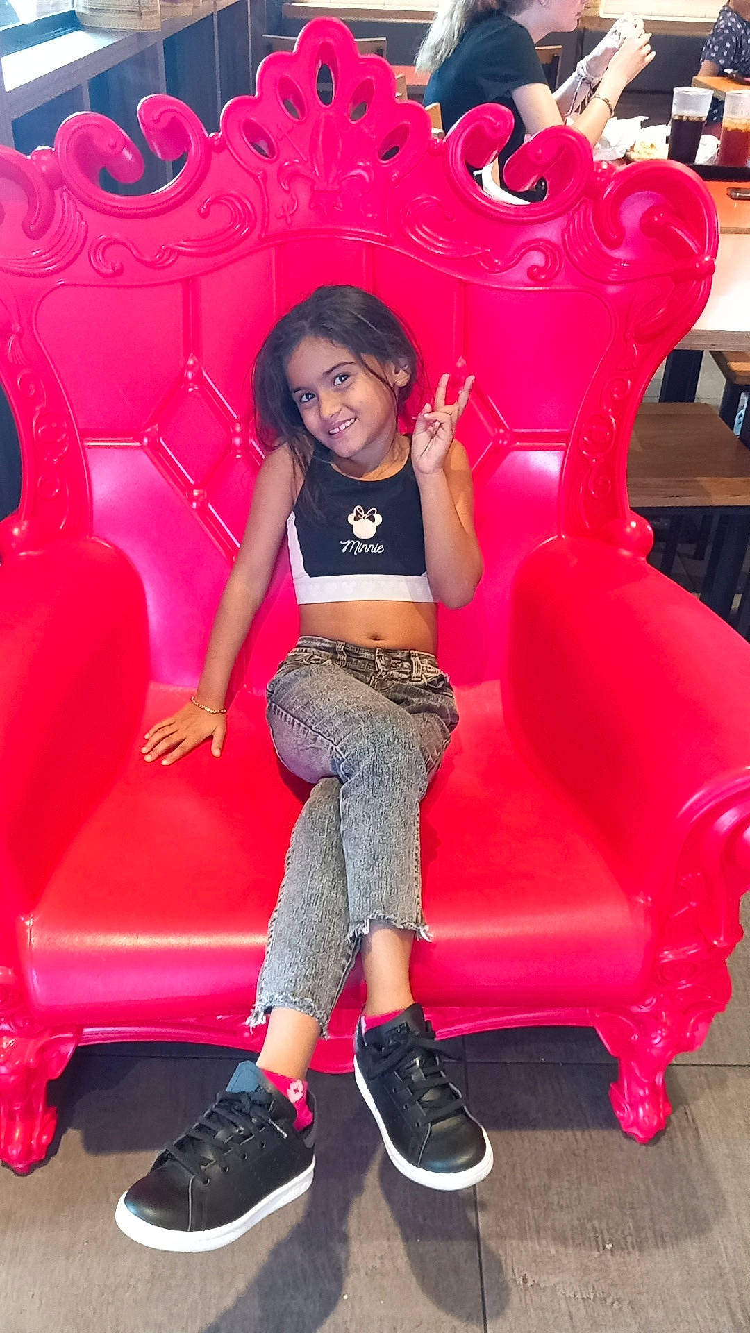 Taylore participe au concours pour gagner de l'argent avec cette photo : black_hair, chair, comfort, fashion_design, footwear, furniture, glove, human_leg, joy, knee, leg, leisure, long_hair, magenta, person, pink, red, shoe, shorts, smile
