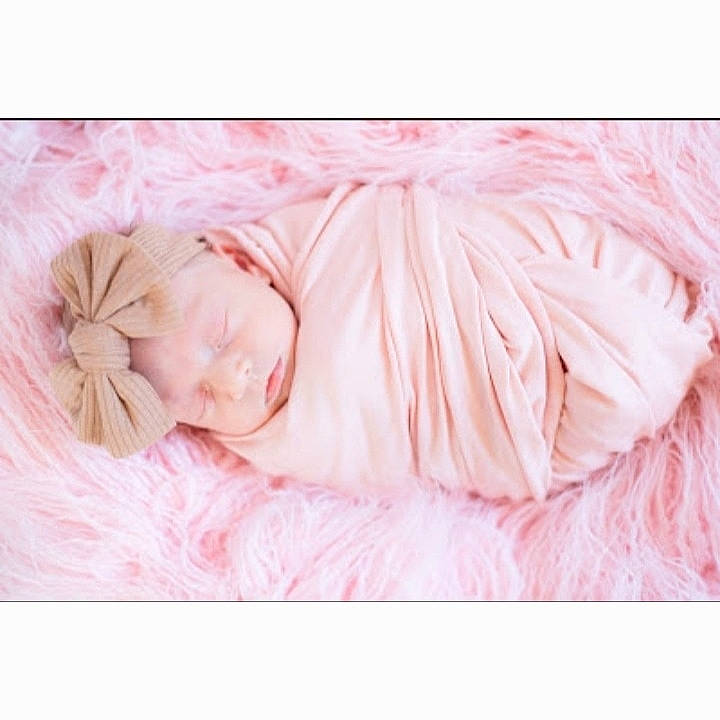 Chloe is registered to the contest to win money with this photo: baby, baby_sleeping, bed, bedding, bedtime, comfort, fashion_accessory, font, fur, happy, linens, magenta, nap, pattern, peach, person, pink, rectangle, sleeve, stock_photography