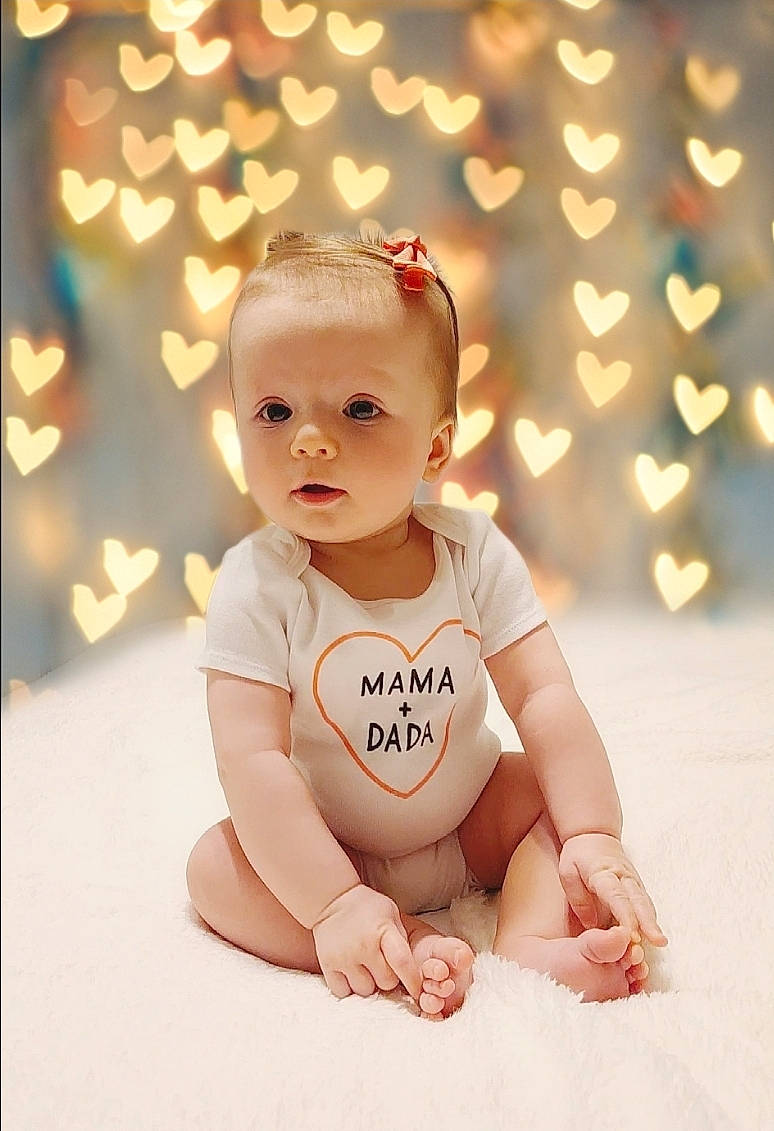 Myla joined the competition — help win amazing prizes! baby, baby_toddler_clothing, cheek, child, finger, flash_photography, flooring, foot, fun, grass, happy, human_leg, knee, nail, people_in_nature, person, portrait_photography, sitting, sleeve, toddler