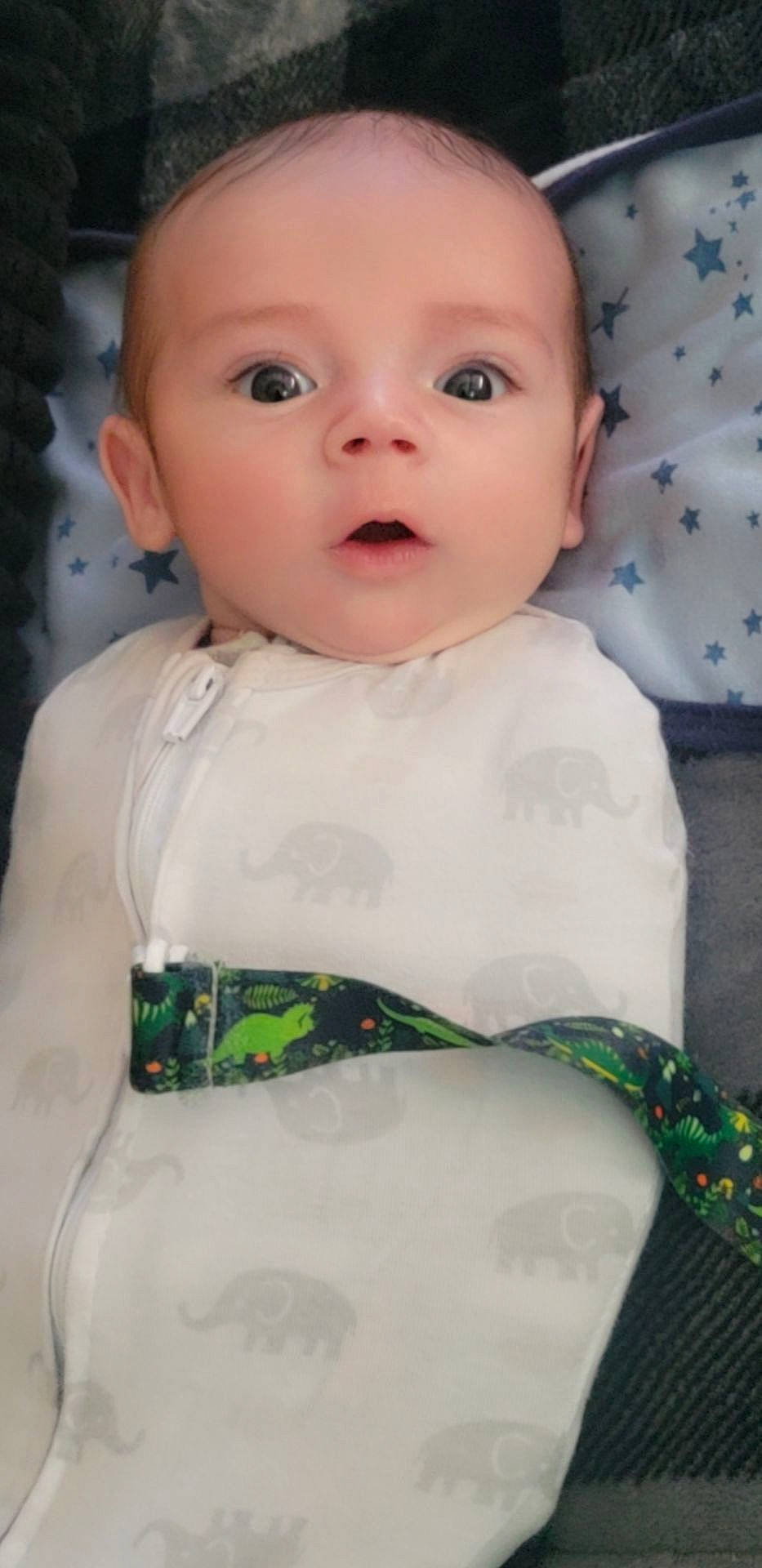 Keaton joined the competition — help win amazing prizes! baby, baby_toddler_clothing, cheek, chin, collar, dress, eye, eyebrow, eyelash, green, head, iris, lip, neck, nose, pattern, person, skin, sleeve, surprise