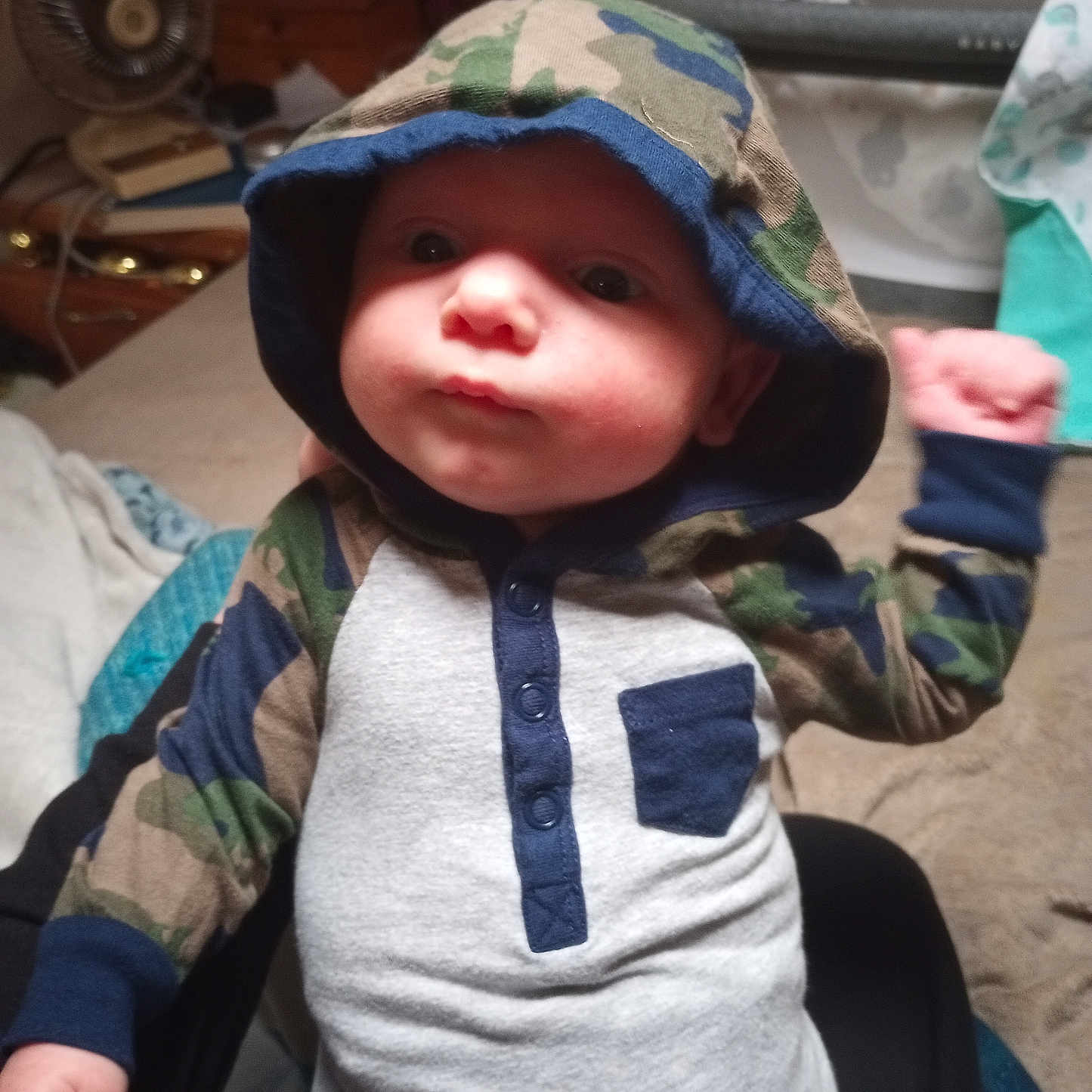 Finnley is registered to the contest to win money with this photo: baby, bodypart, bonnet, cap, clothing, coat, face, finger, hand, hat, head, hood, hoodie, knitwear, person, photography, portrait, sunhat, sweater, sweatshirt