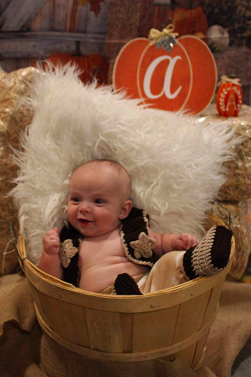 A-lexzion is registered to the contest to win money with this photo: baby, baby_carriage, baby_products, baby_toddler_clothing, basket, box, cheek, child, christmas_eve, event, happy, holiday, natural_foods, person, pumpkin, sitting, smile, toddler, vegetable