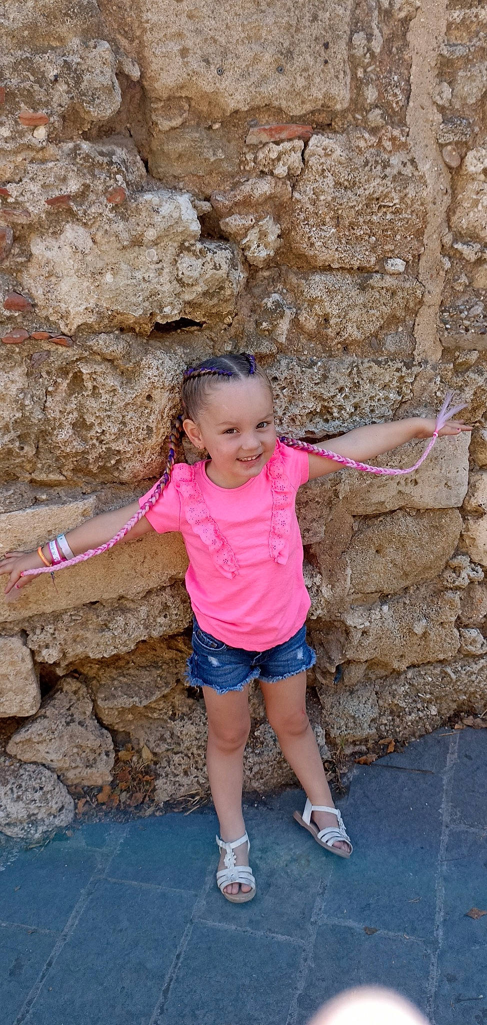 Lyana participe au concours pour gagner de l'argent avec cette photo : beauty, bedrock, denim, fun, happy, human_leg, joy, leg, leisure, person, photograph, pink, shoe, shorts, smile, standing, summer, t_shirt, thigh, toddler