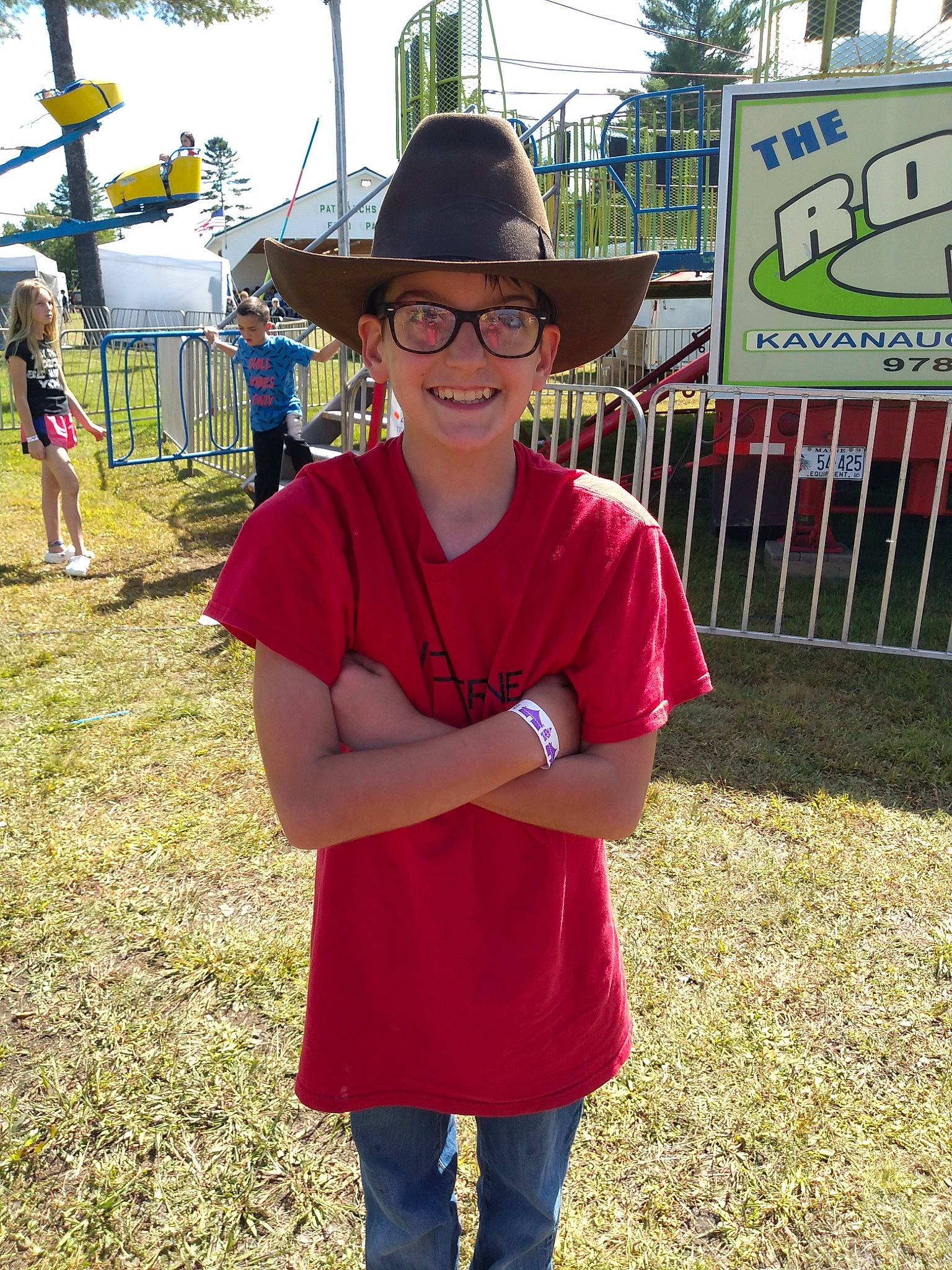 Scott is registered to the contest to win money with this photo: child, community, headwear, joy, person, recreation, smile, style, t_shirt