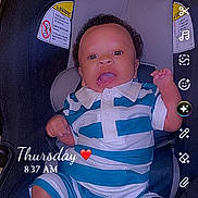 Kadence is registered to the contest to win money with this photo: baby, child, car_seat, striped_shirt, smiling, happy, infant, socks, indoor, seatbelt, portrait, cute, safety, snapchat_interface, timestamp, emoji, clothing, person, face, expression