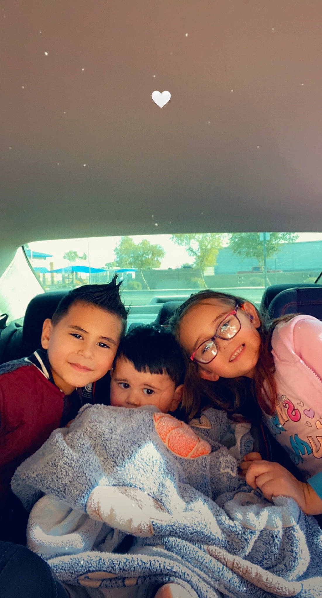 Jordann is registered to the contest to win money with this photo: black_hair, child, cool, electronic_device, event, facial_expression, friendship, fun, grass, happy, interaction, joy, leisure, luxury_vehicle, person, sitting, skin, smile, technology, toddler