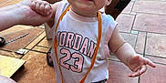 Maisie joined the competition — help win amazing prizes! baby, child, smiling, standing, barefoot, jordan_23, medal, holding_hand, person, adult, shorts, tiled_floor, outdoor, sunlight, casual, happy, closeup, portrait, foot, hand