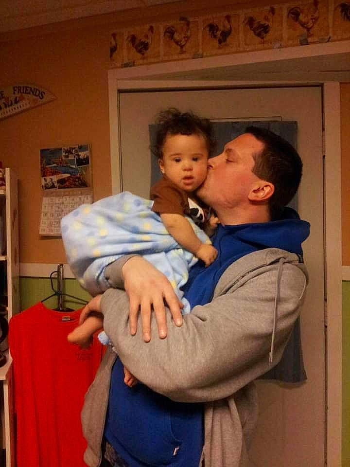 Jaleel Ramone is registered to the contest to win money with this photo: abdomen, bookcase, cheek, child, comfort, event, fun, gesture, happy, hug, love, nose, person, picture_frame, room, shelf, sitting, t_shirt, toddler, vacation