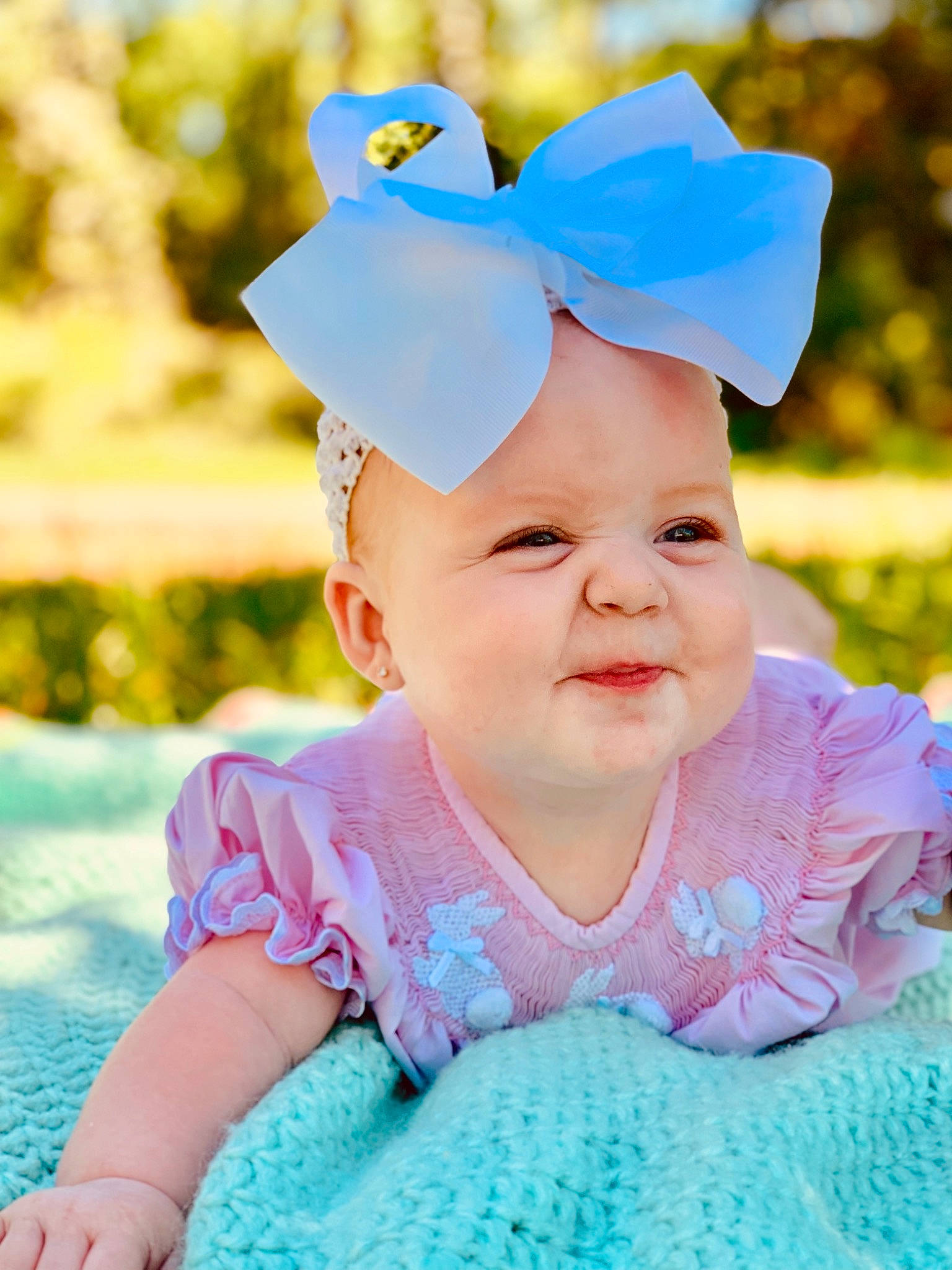 Annaleigh is registered to the contest to win money with this photo: aqua, baby, baby_laughing, baby_toddler_clothing, blue, child, ear, fashion_accessory, fun, hair_accessory, happy, headband, headgear, person, photography, pink, product, skin, smile, toddler