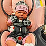Locklynn joined the competition — help win amazing prizes! baby, car_seat, pink, gray, mittens, hat, clothing, infant, straps, safety, newborn, cute, face, person, seatbelt, white_socks, text, indoor, resting, portrait
