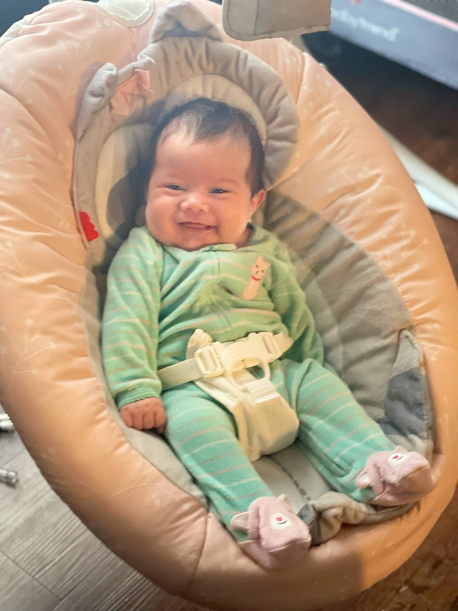 Everly is registered to the contest to win money with this photo: baby, baby_carriage, baby_products, baby_toddler_clothing, cheek, child, circle, comfort, eye, face, fun, happy, human_body, lap, mouth, person, sitting, skin, sleeve, smile