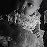 Mercy is registered to the contest to win money with this photo: baby, black_and_white, child, closeup, clothing, cute, dress, eyes, face, gaze, hands, high_contrast, infant, portrait, ruffles, sitting, skin, soft_light, studio_style, tutu