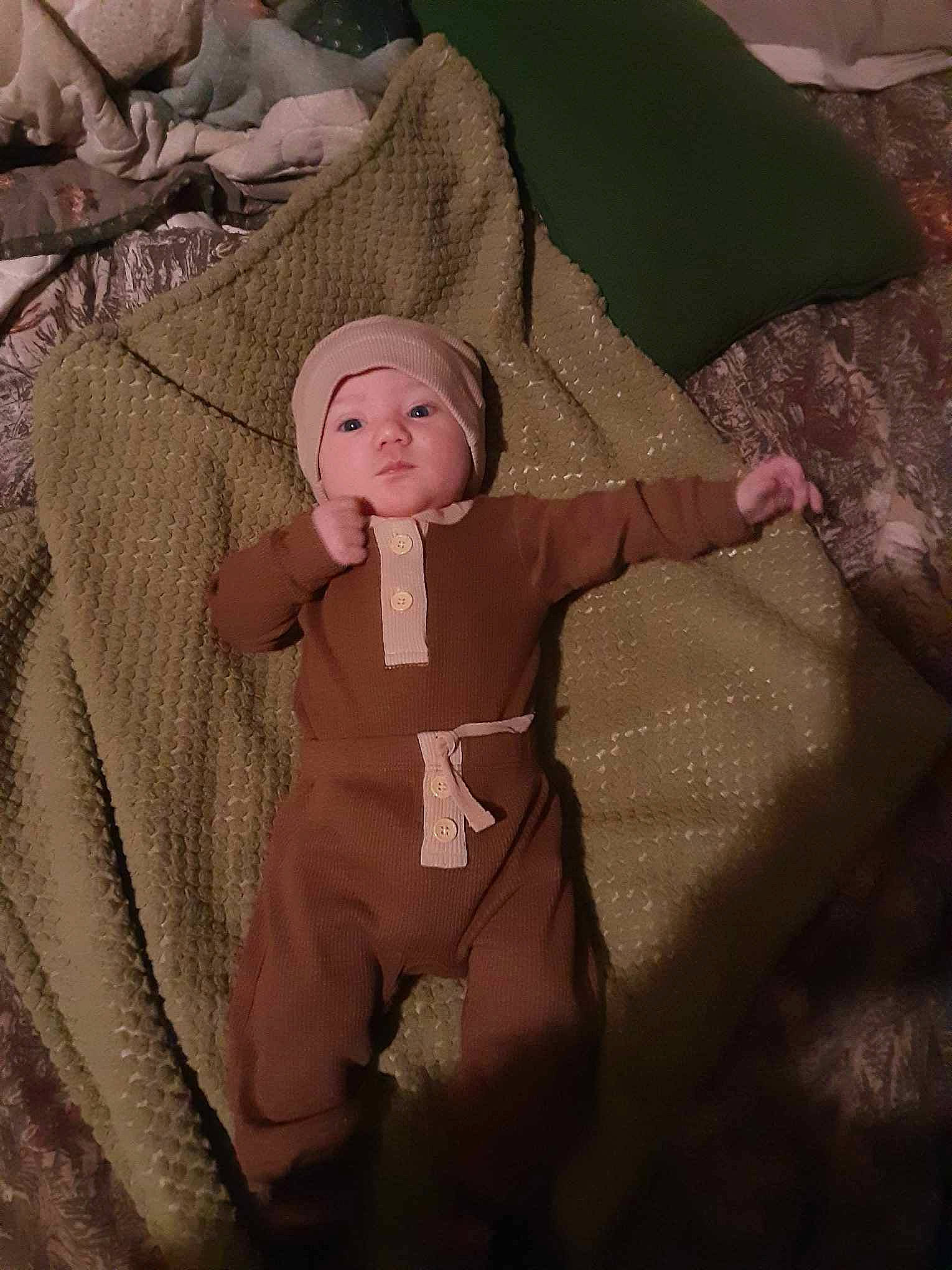Chase is registered to the contest to win money with this photo: baby, baby_products, baby_toddler_clothing, brown, child, comfort, costume, costume_hat, doll, fashion_accessory, fur, gesture, headwear, linens, peach, person, pink, sleeve, stuffed_toy, toddler