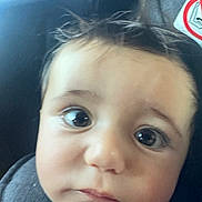 Amir participe au concours pour gagner de l'argent avec cette photo : baby, child, face, eyes, hair, car_seat, closeup, infant, portrait, expression, curious, seatbelt, indoors, person, head, skin, cheeks, young, cute, childhood