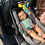 Amir participe au concours pour gagner de l'argent avec cette photo : baby, car_seat, child, car_interior, seatbelt, plush_toy, sunlight, vehicle, window, person, hair, clothing, seat, safety, restraint, road_trip, young_child, casual, family, side_view