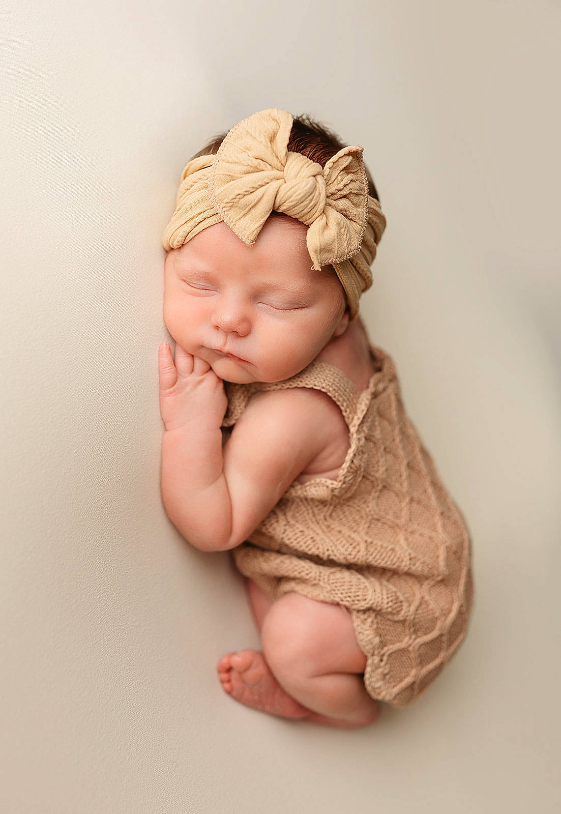 Paisley is registered to the contest to win money with this photo: arm, art, baby, baby_toddler_clothing, cap, cheek, comfort, eye, foot, gesture, hand, head, headwear, human_body, leg, linens, lip, nail, person, thumb