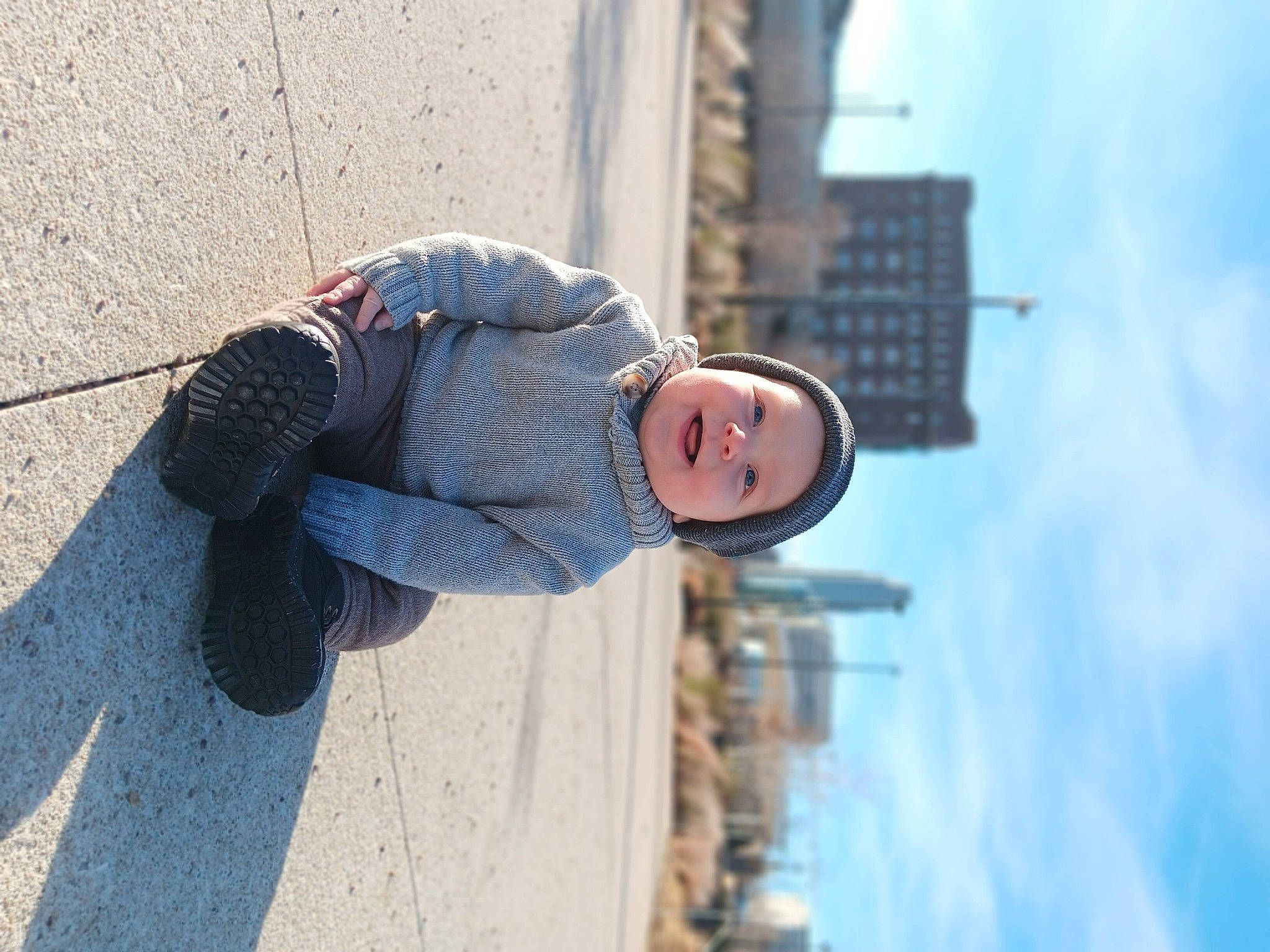 Lucas joined the competition — help win amazing prizes! azure, building, city, cloud, concrete, denim, electric_blue, eyewear, hat, headwear, joy, pattern, pedestrian, person, portrait_photography, sitting, sky, smile, street, sunglasses