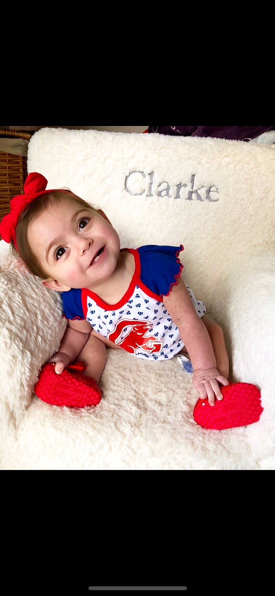 Clarke is registered to the contest to win money with this photo: baby, baby_toddler_clothing, beanie, child, child_model, costume, ear, fur, happy, headgear, knit_cap, lip, pattern, person, photography, play, product, red, skin, smile