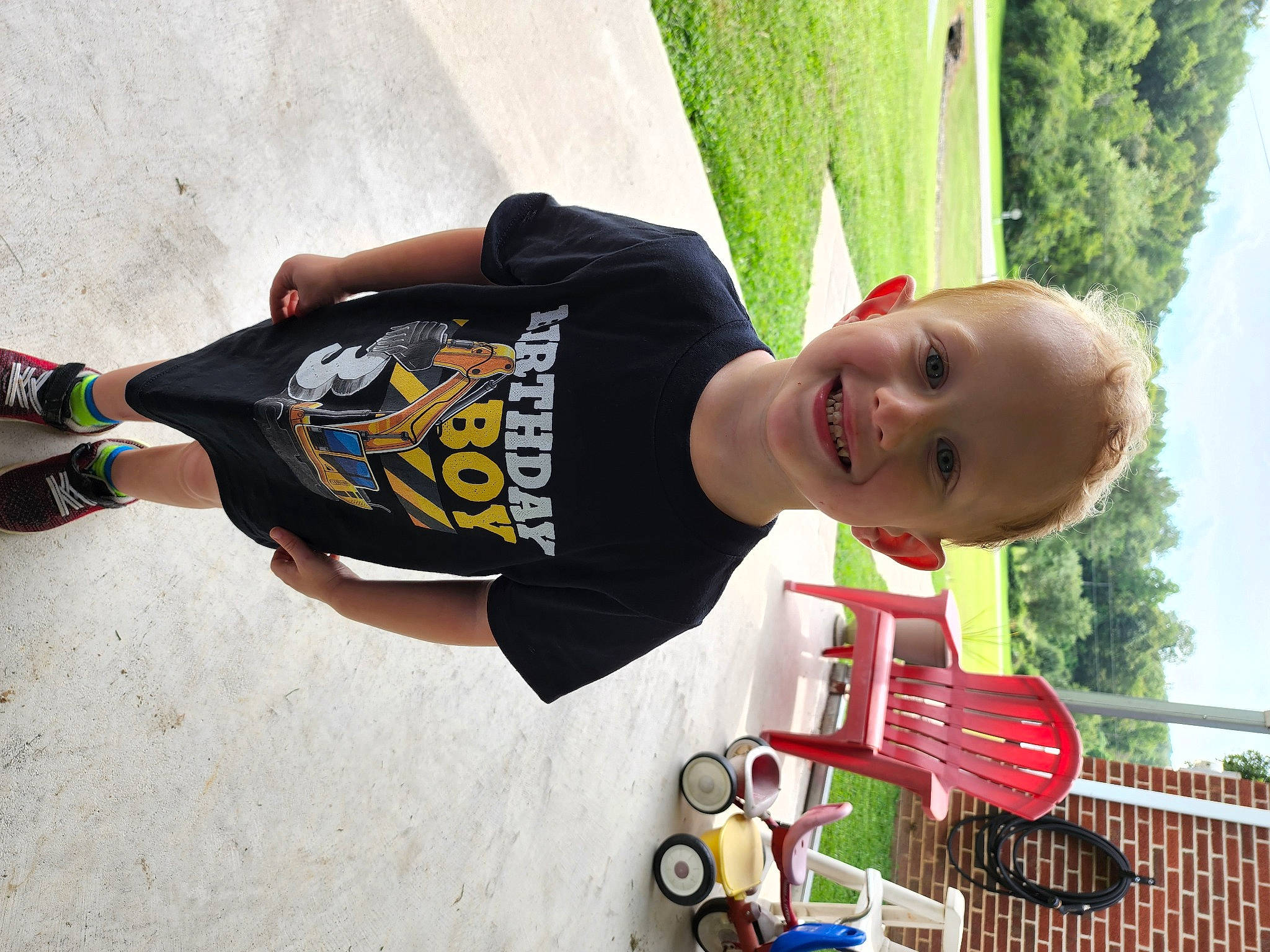 Brian joined the competition — help win amazing prizes! child, elbow, fence, fun, grass, green, happy, joy, leisure, people_in_nature, person, photography, plant, recreation, sky, sleeve, smile, sportswear, t_shirt, toddler