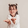 child, girl, glasses, smiling, happy, bubbles, white_shirt, casual, jeans, portrait, indoor, cute, hair_buns, playful, hands_out, joyful, fashion, young, studio, light_background