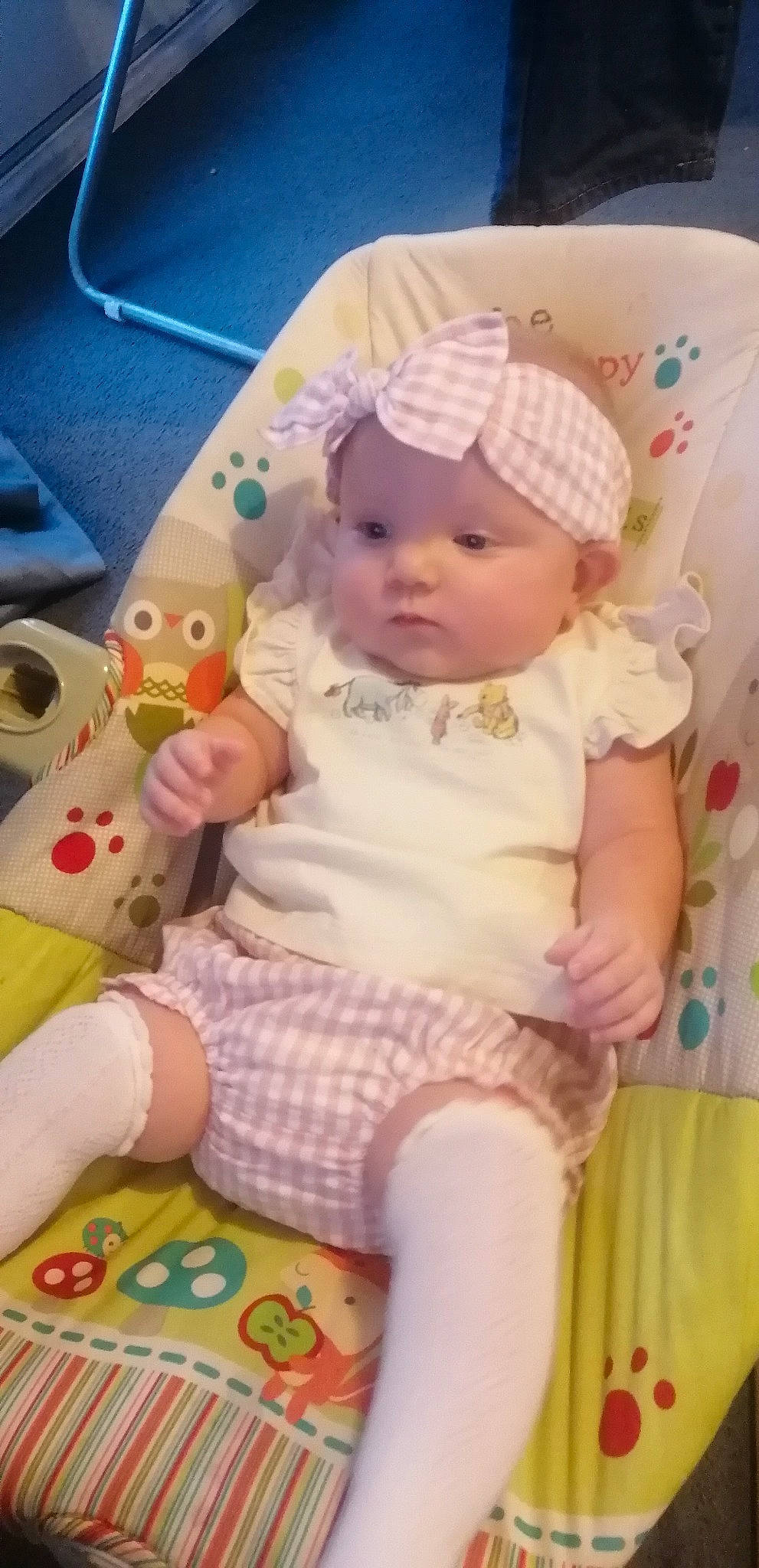 Melody is registered to the contest to win money with this photo: baby, baby_products, baby_toddler_clothing, cap, cheek, child, comfort, fashion_accessory, hat, headwear, human_leg, lap, pattern, person, pink, sitting, skin, sleeve, sock, textile
