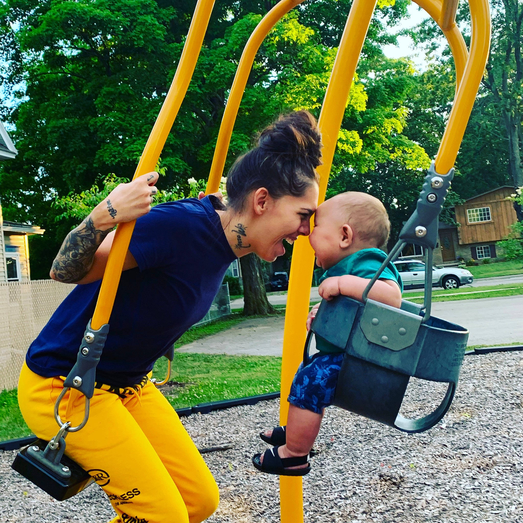 Lucciano joined the competition — help win amazing prizes! child, city, fun, human_settlement, leisure, outdoor_play_equipment, park, person, play, playground, public_space, recreation, smile, swing, toddler, tree, vacation, yellow