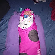 Loraly is registered to the contest to win money with this photo: baby, newborn, sleeping, infant, pacifier, pink, swaddle, blanket, pillow, bed, indoors, portrait, face, clothing, textile, purple, magenta, cozy, resting, cute