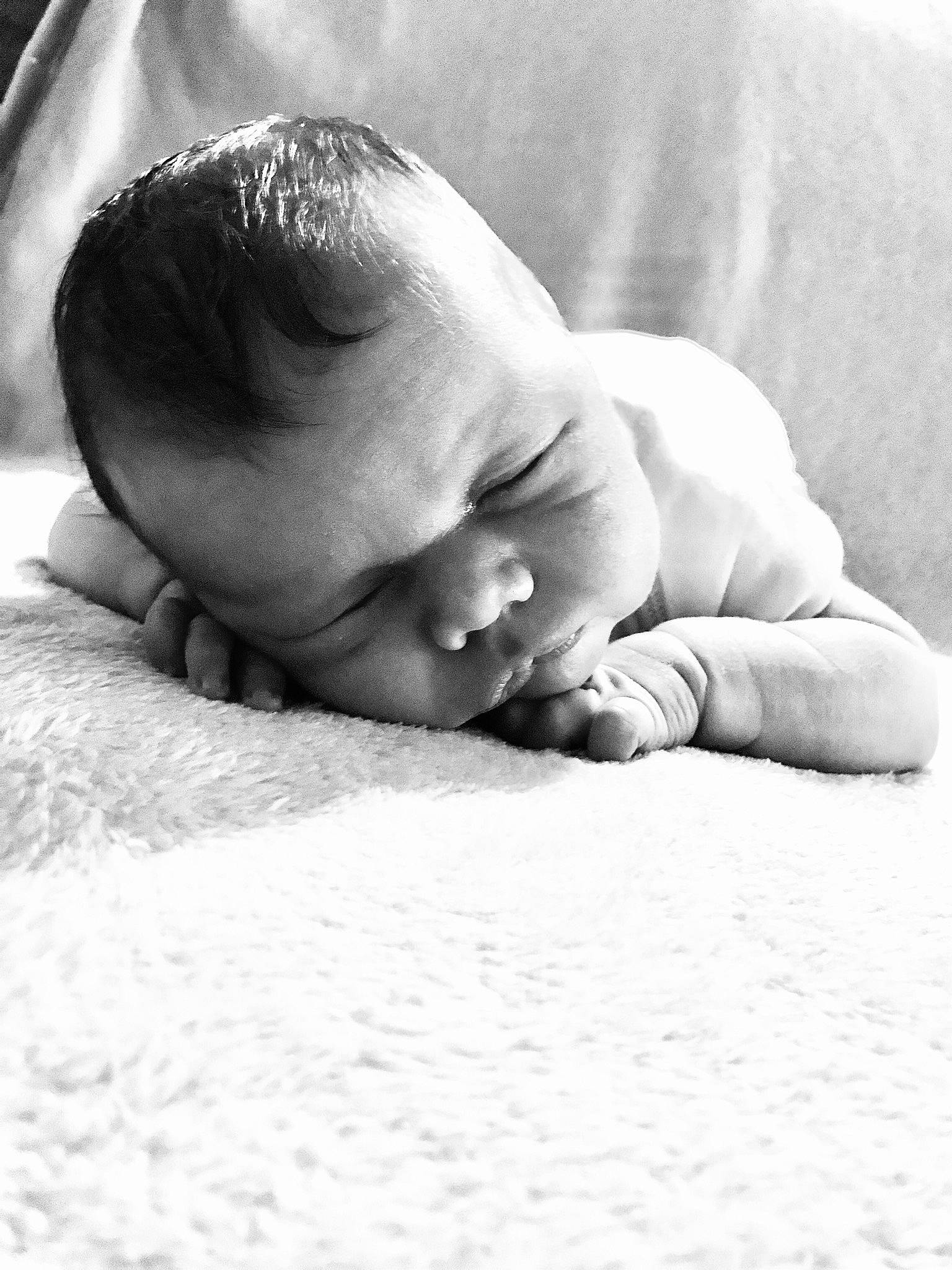 Walker is registered to the contest to win money with this photo: baby, baby_sleeping, bedtime, black_and_white, child, comfort, hand, monochrome, monochrome_photography, nap, person, photograph, photography, portrait_photography, skin, sleep, smile, stock_photography, toddler, tummy_time