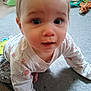 baby, child, crawling, carpet, toy, floor, clothing, indoor, person, cute, infant, patterned_shirt, hand, face, eyes, pink, white, playtime, curious, young