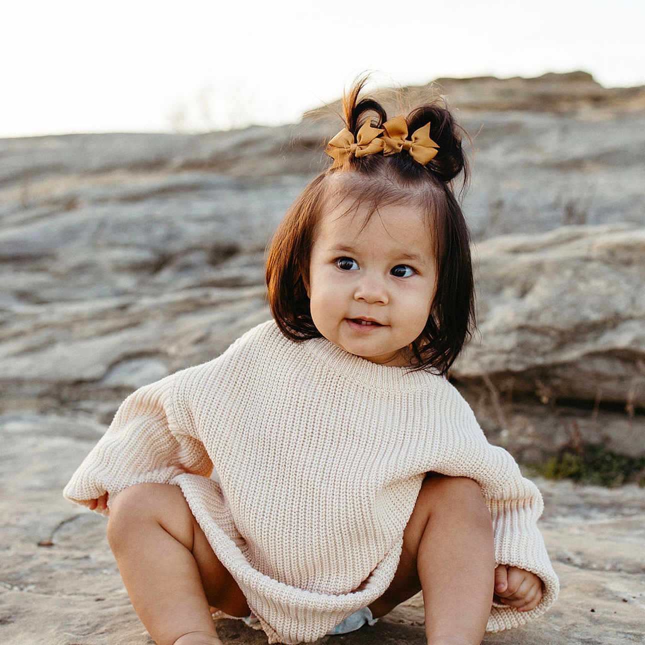 Sterling joined the competition — help win amazing prizes! bodypart, child, clothing, crawling, dress, face, female, finger, girl, happy, head, knitwear, person, photography, portrait, rock, sitting, sleeve, smile, sweater