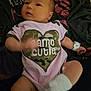 Brinley joined the competition — help win amazing prizes! baby, infant, onesie, pink_clothing, camouflage, heart_shape, hospital_wristband, blanket, socks, lying_down, newborn, arm_movement, leg_movement, soft_fabric, cute, indoors, person, skin, face, baby_garment