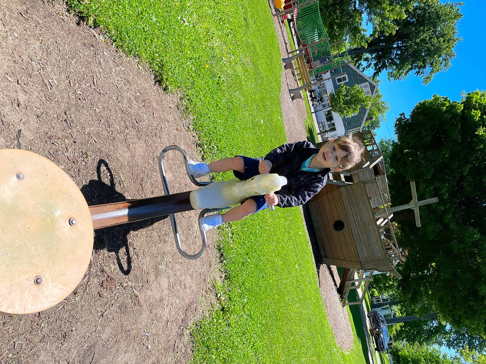 Jase is registered to the contest to win money with this photo: adventure, circle, extreme_sport, fun, grass, helmet, landscape, leisure, musical_instrument, outdoor_play_equipment, person, plant, pole, recreation, rope, shadow, soil, sports, sports_equipment, tree
