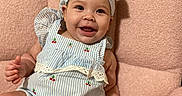 Kalani is registered to the contest to win money with this photo: baby, babylaughing, face, happy, head, person, sitting, smile